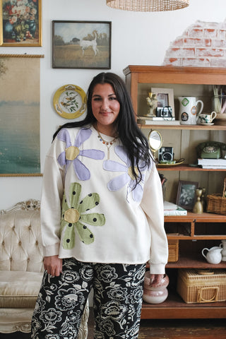 Woman wearing ivory retro floral patchwork crewneck