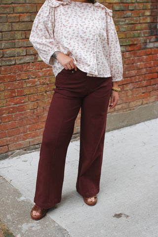 Woman wearing maroon pull-on wide leg pants
