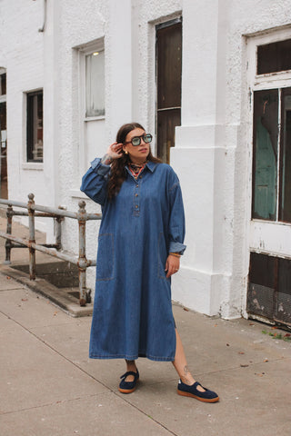 Woman wearing medium wash denim midi dress