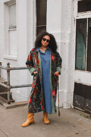 Woman wearing dark teal floral velvet duster