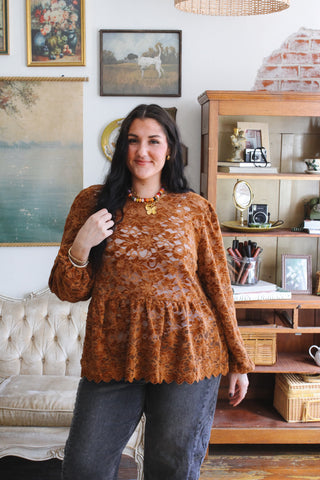 Woman wearing dark cognac floral lace babydoll top
