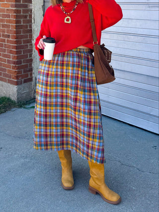 Woman wearing red plaid pull-on midi skirt