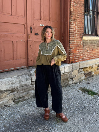 Woman wearing washed olive micro floral henley top