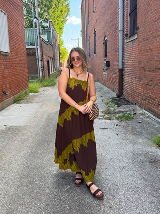 Woman wearing brown tiered lace maxi dress