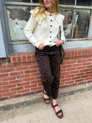 Woman wearing brown micro floral corduroy pants
