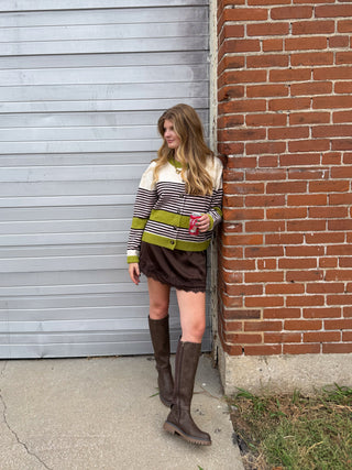 Woman wearing striped colorblock knit cardigan