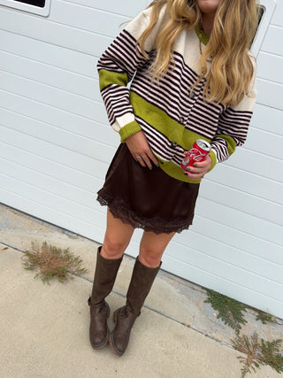 Woman wearing chocolate satin lace skort