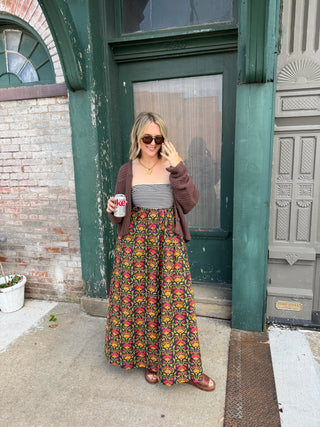 Woman wearing floral strapless maxi dress
