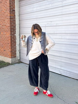 Woman wearing washed black gauze barrel leg pull-on pants