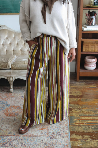 Woman wearing mustard striped wide leg pull-on pants