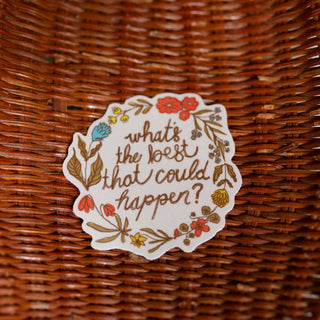 A round white sticker with a floral border and the handwritten text 'what's the best that could happen?