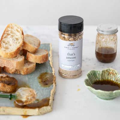 3.3 oz. That's Amore Topper Seasoning